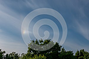 atmospheric optical phenomena. Iridescent clouds with blue sky