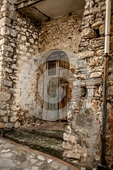 Atmospheric Photo of an Old Decaying Wooden Door in an Abandoned Building