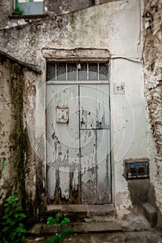 Atmospheric Photo of an Old Decaying Wooden Door in an Abandoned Building