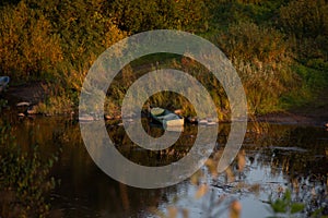 Atmospheric photograph of abandoned boats on the river bank