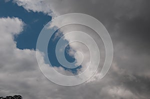 Atmospheric sky art image. White Cumulonimbus cloud in blue sky. Australia