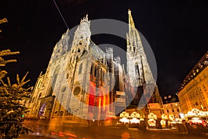 Atmospheric View, Blurred Motion of Vienna`s Stephansdom with Christmas Market at Night, Wien or Vienna, Austria, Europe