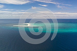 Atoll with an island of white sand.