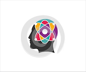 atom with its electron trajectory inside human head for science physic technology laboratory vector logo design photo