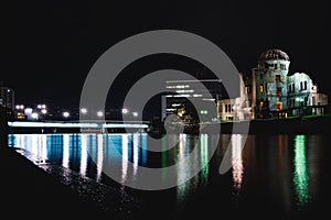 The Atomic Bomb Dome, monument for the second world war, along the river in the night, Hiroshima, Japan