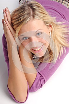 Atractive blonde woman in violet sweater