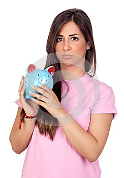Atractive girl with a blue piggy-bank