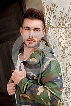Atractive guy with jacket with military stylish