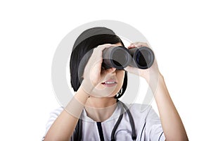 Atractive medical girl looking through binoculars