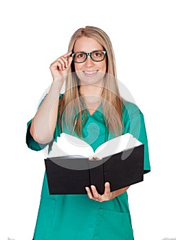 Atractive medical with glasses reading a book