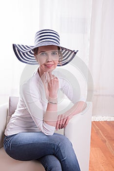 Atractive woman with blue-white hat
