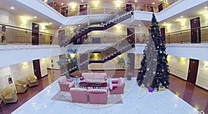 Atrium with armchairs, couches and Christmas tree photo