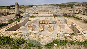 Atrium with lobed fountain in the House of the Labors of Hercules at the Archeological Site of Volubilis in Morocco.