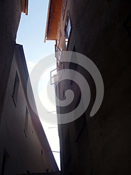 Atrium, narrow dark lane with light from above