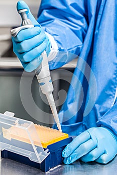 Attaching a disposable tip to a micropipette photo