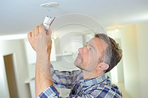 Attaching smoke alarm to ceiling