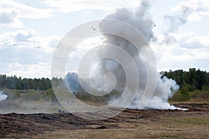 Attack of Soviet soldiers from the trenches. Smoke from an exploding smoke bomb. Reconstruction of the battle of World