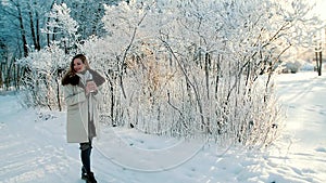 Attactive woman confident walking on the snow