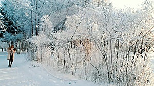 Attactive woman confident walking on the snow