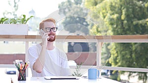 Attending Phone Call, Communicating, Sitting Outdoor