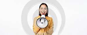 Attention announcement. Image of asian woman shouting in megaphone, recruiting, searching people, sharing information