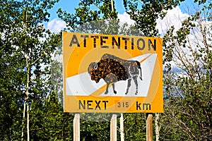 An attention bison of roadway for the next 315km warning sign