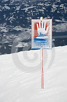 Attention, caution, warning sign against avalanche