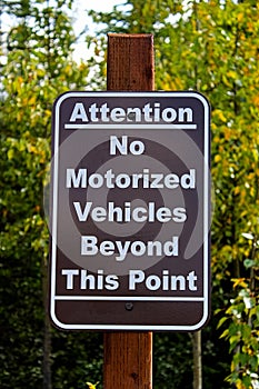 An attention no motorized vehciles beyond this point sign