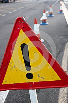 Attention sign. Road traffic limited. Triangle with red border. Bypass at the street