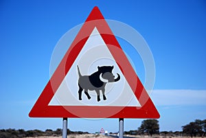 Attention warthogs crossing, road sign in Namibia