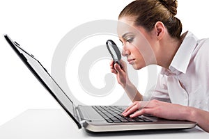 Attentive businesswoman typing on laptop