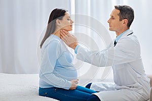 Attentive doctor examining his patient