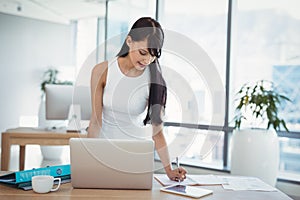 Attentive executive working at desk