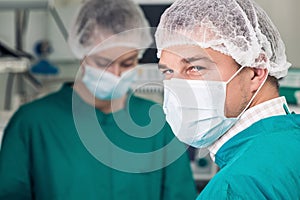 Attentive look of surgeon in mask