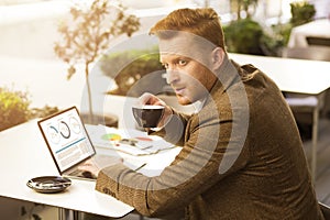 Attentive man with a cup of coffee stock photo