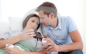 Attentive man giving pills to his wife