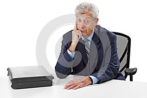 Attentive senior business man listens