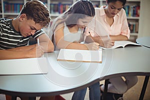 Attentive students studying in library