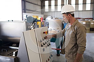 Attentive technician operating a machine