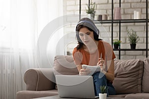 Attentive young woman study from home online at quarantine period