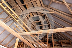 Attic of a barn with waterproofing and various pallet and wooden boxes