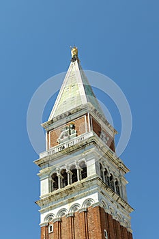 Attic of the bell tower with the lion of Saint Mark and the allegorical figure of Venice as Justice crowned and seated on a