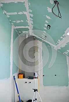 Attic conversion, remodel into a bathroom. Bathroom installation in the attic with construction of moisture-resistant drywall,