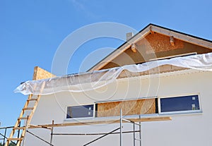 Attic Insulation. House Facade Construction Exterior photo