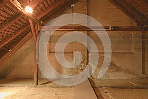 Attic loft insulation. Old loft. renovation and thermal insulation with mineral rock wool. photo