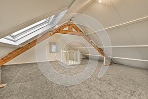 loft conversion with lofted ceiling and a baby gate photo