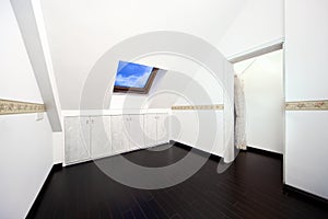 Attic room with roof skylight window