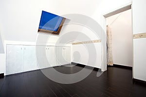 Attic room with roof skylight window photo