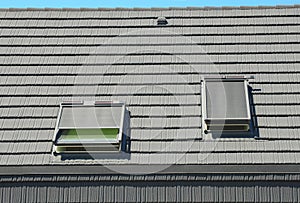 Attic Skylights with Roof Windows Shades, Blinds, Curtains for House Energy Efficiency. Modern House Roof Exterior Design.