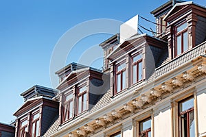 Attic windows on roof of building